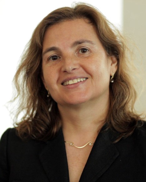 Headshot of Daniela Rus, a smiling woman with brown hair wearing a dark jacket