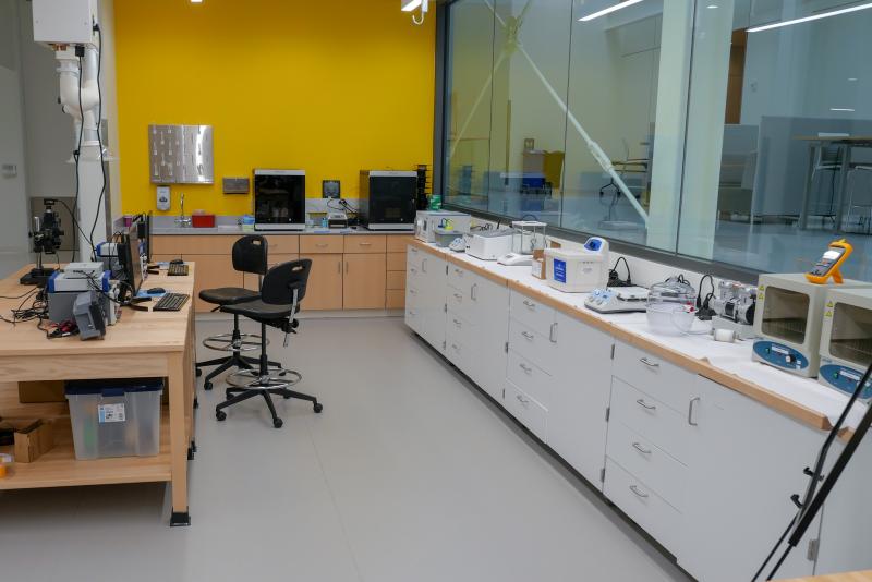 Lab space with equipment on tables and counters